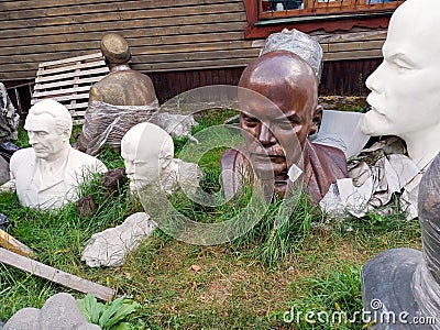 Busts and monuments of the Soviet period thrown into the street Editorial Stock Photo
