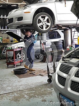 Mechanic under the car Editorial Stock Photo