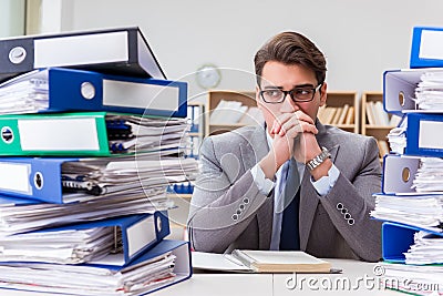 The busy businessman under stress due to excessive work Stock Photo