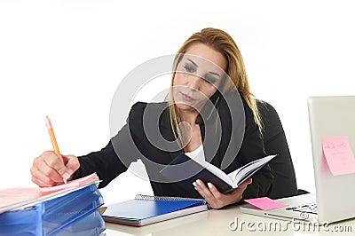 busy businesswoman in stress working with laptop computer talking on mobile phone multitasking Stock Photo