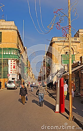 Busy commercial Republic street with Wembley Store under construction with Christmas decoration & visitor guide, Valletta, Malta Editorial Stock Photo