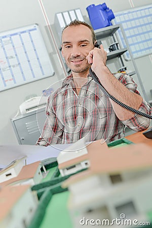 Busy employee on phone Stock Photo