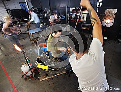 Busy Glass Factory Workers Stock Photo