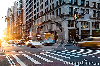 Busy intersection on 5th Avenue and 23rd Street in New York City with rush hour traffic Editorial Stock Photo