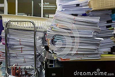 Busy, messy and cluttered workplace, full of documents Stock Photo