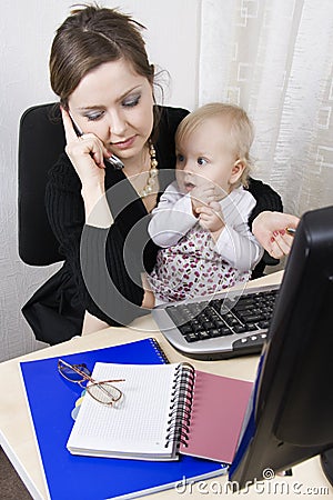 Busy mother with her baby Stock Photo