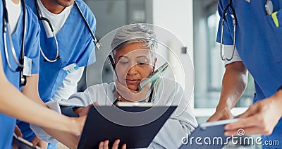 Busy, phone call and doctor with medical paperwork, health communication and help from nurse team at a hospital. Chaos Stock Photo