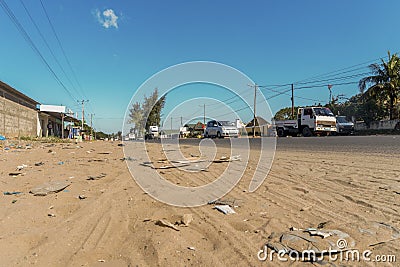 Busy road with many trash along it in Maputo, Mozambique Editorial Stock Photo