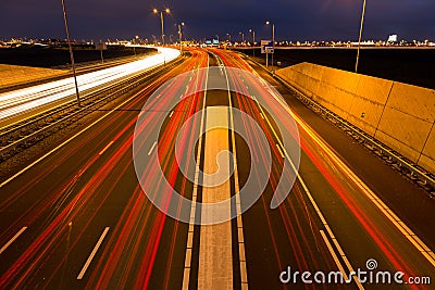 Busy rush hour traffic leaves light trails on the A9 highway Stock Photo