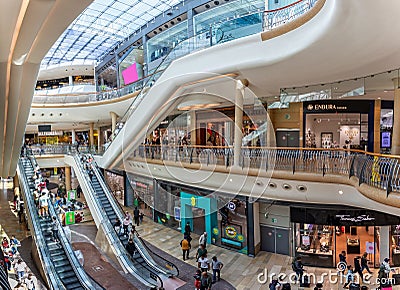 Busy scene with shoppers on escalators inside the Bullring Shopping Mall in Birmingham, West Midlands, UK Editorial Stock Photo