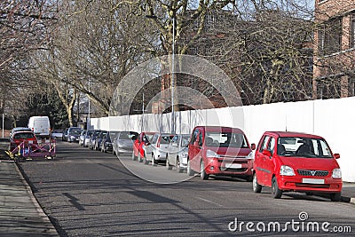 Busy street parked cars Stock Photo