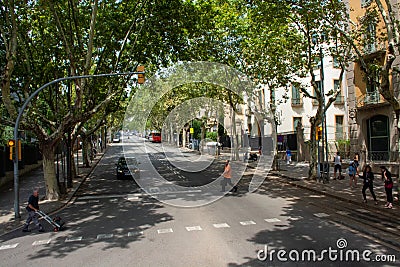 Busy street with pedestrians waiting to cross road of Barcelona Editorial Stock Photo