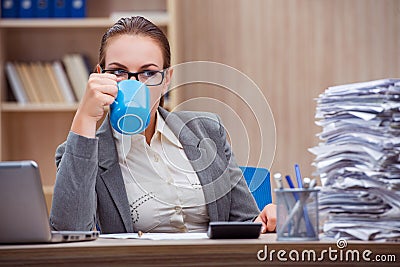 The busy stressful woman secretary under stress in the office Stock Photo