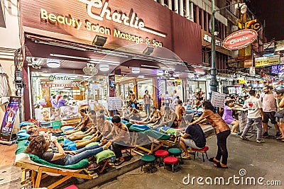 Busy Thai outdoor massage salon Editorial Stock Photo