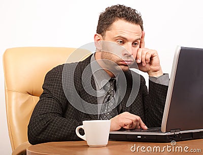 Busy time in stressful job - business man working with laptop Stock Photo