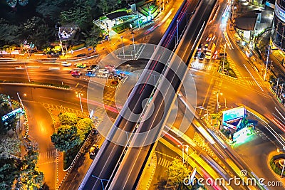 long exposure of a busy city in a night with cars creating interesting light trails from their headlamps Stock Photo