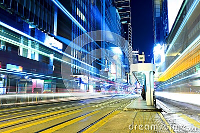 Busy traffic with tram stop in Hong Kong city Stock Photo