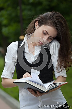 Busy woman serching ing notebook Stock Photo