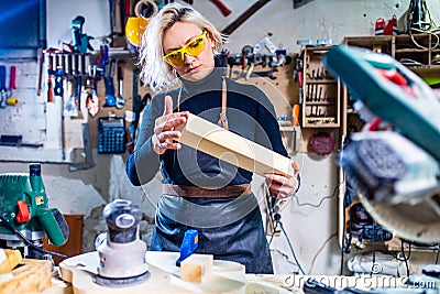 Busy wood designer in a small carpentry workshop Stock Photo