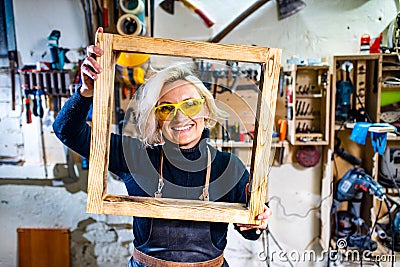 Busy wood designer in a small carpentry workshop Stock Photo