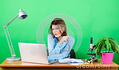 Busy working in office. chemist biologist with microscope on table. woman work in office on laptop. digital science Stock Photo