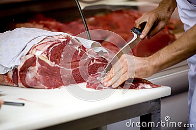 Butcher Cutting Meat Stock Photo