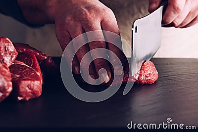 Butcher hands close up Stock Photo