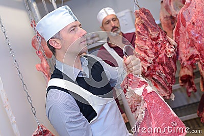 Butcher hanging up side animal Stock Photo