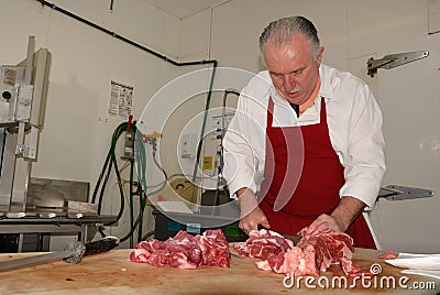 Butcher prepares boneless chuck roasts Stock Photo