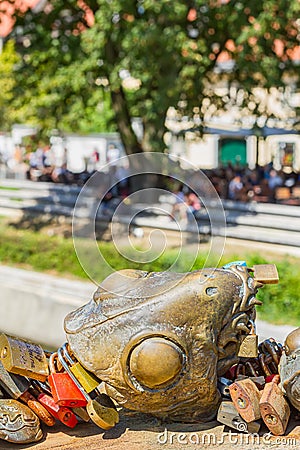 Ljubljana, Slovenia - August 16, 2018: A bronze sculpture by Slovenian artist Jakov Brdar covered by tourists' love padlocks Editorial Stock Photo