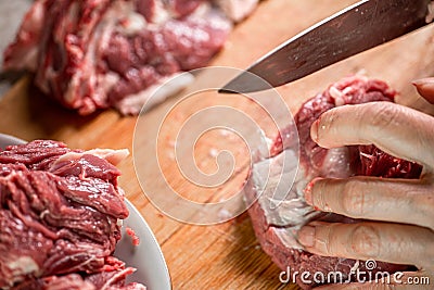 Butchering meat on a cutting board Stock Photo