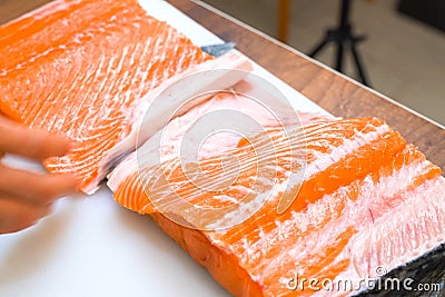 Butchering salmon, piece of salmon red fish meat Stock Photo