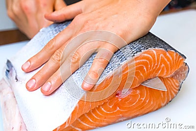 Butchering salmon, piece of salmon red fish meat Stock Photo