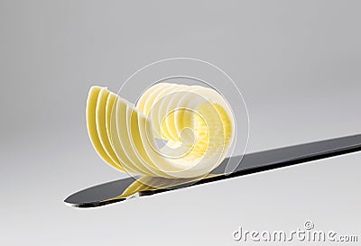 Butter curl on a knife Stock Photo