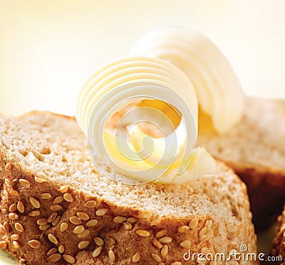 Butter on a Slice of Bread Stock Photo