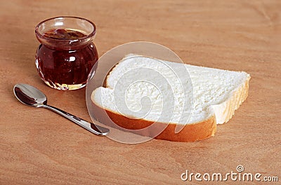 Buttered bread with jam pot Stock Photo