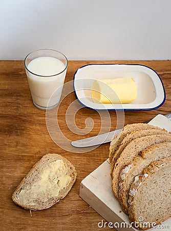 Buttered bread with milk Stock Photo