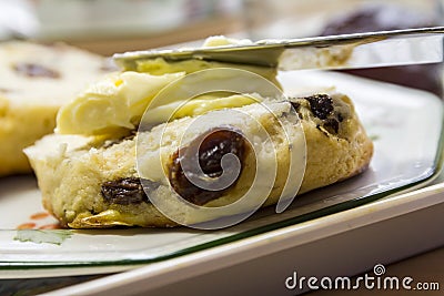 Buttered Scone with Knife Stock Photo