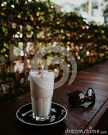 Butterscotch latte and sunglasses Stock Photo