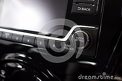 Button control of audio multimedia control panel in car. Stock Photo