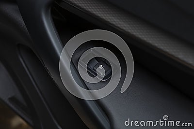 The button of the electric window of the car.An internal accessory of the car Stock Photo