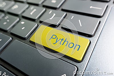 button with the python on the yellow keyboard of modern laptop Stock Photo