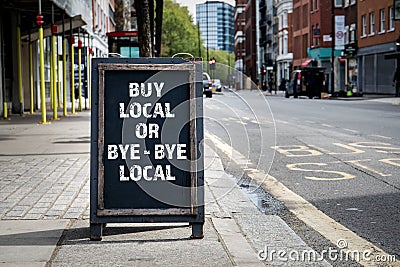 BUY LOCAL OR BYE - BYE LOCAL. Foldable advertising poster Stock Photo