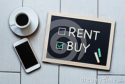 Buy not rent blackboard concept. Choosing buying over renting. Stock Photo