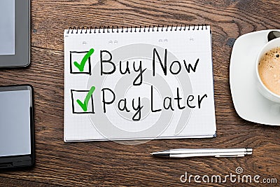 Buy Now Pay Later Concept In Notepad Stock Photo