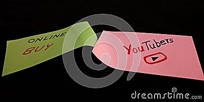 buy online youtubers concept displaying with using text slips on black background Editorial Stock Photo
