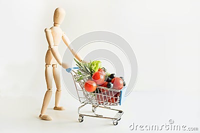 Buyer as dolls with grocery trolley. Full food basket. Concept shopping Stock Photo