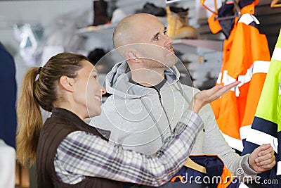 Buying safety jackets at store Stock Photo