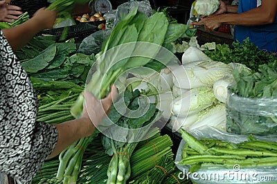 Buying Vegetables at Fresh Market Stock Photo