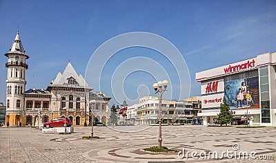 Buzau palace and Winmarkt and h&m market from buzau romania and dacia square Editorial Stock Photo